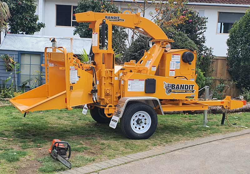 Trees DONE Bandit chipper and truck